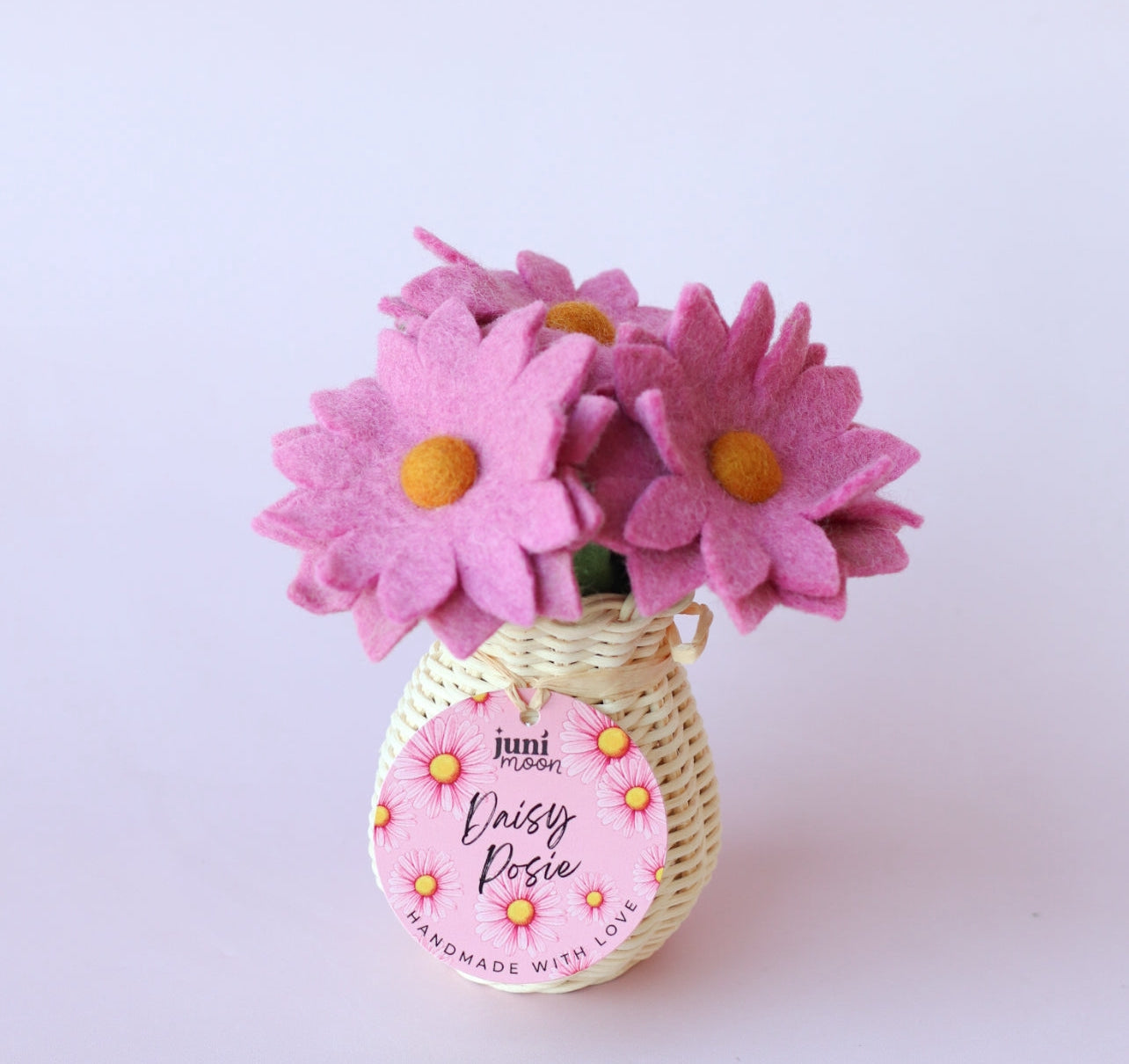 Daisy posies with rattan vase